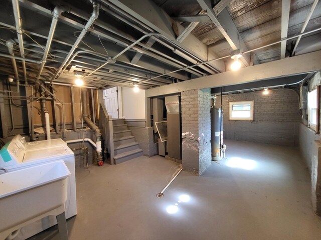 5133 W 64th St, Chicago, IL 60638 - basement with brick wall, washer and dryer, gas water heater, and stairway