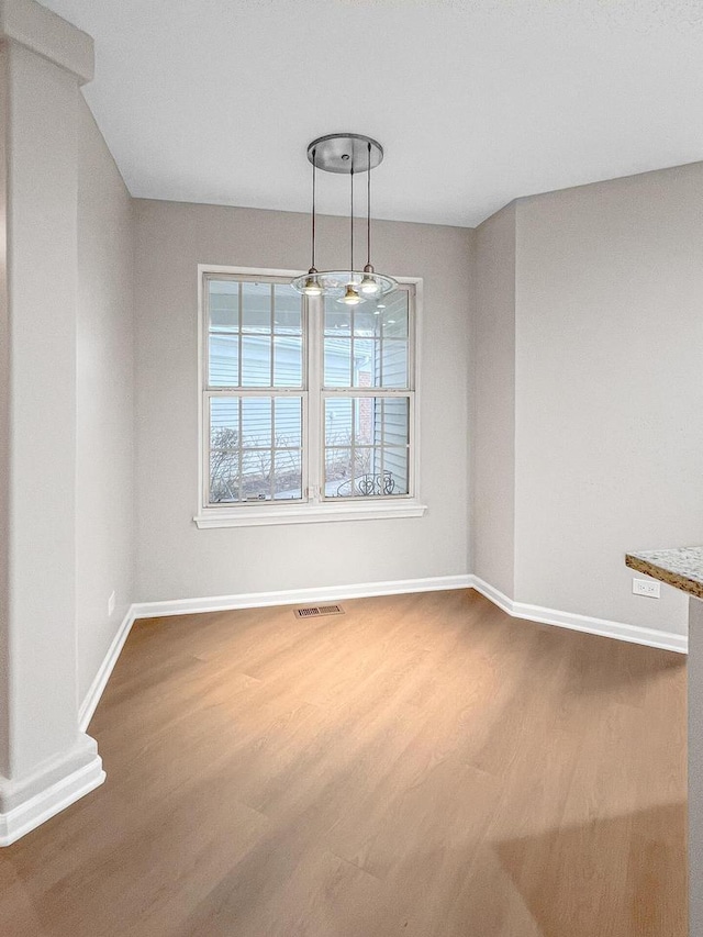 2073 Cambria Ct, Northbrook, IL 60062 - unfurnished dining area with baseboards, wood finished floors, and visible vents
