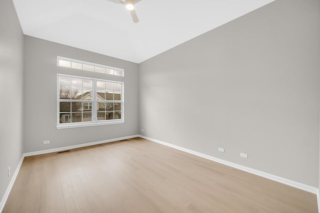 2073 Cambria Ct, Northbrook, IL 60062 - empty room with lofted ceiling, baseboards, a ceiling fan, and wood finished floors