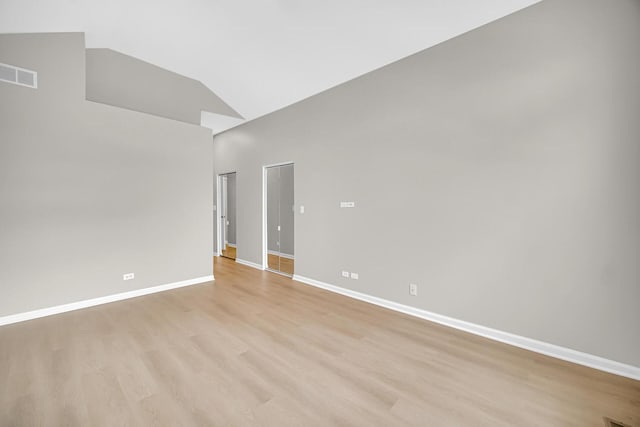 2073 Cambria Ct, Northbrook, IL 60062 - unfurnished room featuring light wood finished floors, baseboards, visible vents, and lofted ceiling