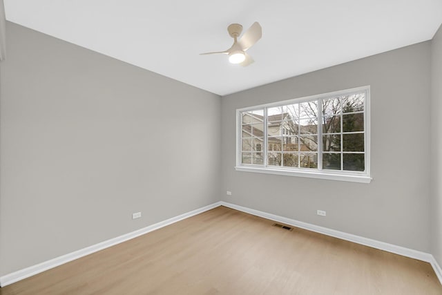 2073 Cambria Ct, Northbrook, IL 60062 - spare room featuring wood finished floors, visible vents, a ceiling fan, and baseboards