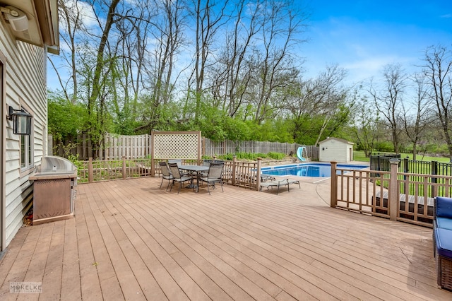 7S745 State Route 53rd Hwy, Naperville, IL 60540 - wooden terrace with outdoor dining space, a fenced backyard, and view of wooded area