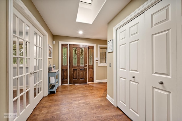 7S745 State Route 53rd Hwy, Naperville, IL 60540 - foyer entrance featuring recessed lighting, a skylight, baseboards, wood finished floors, and plenty of natural light