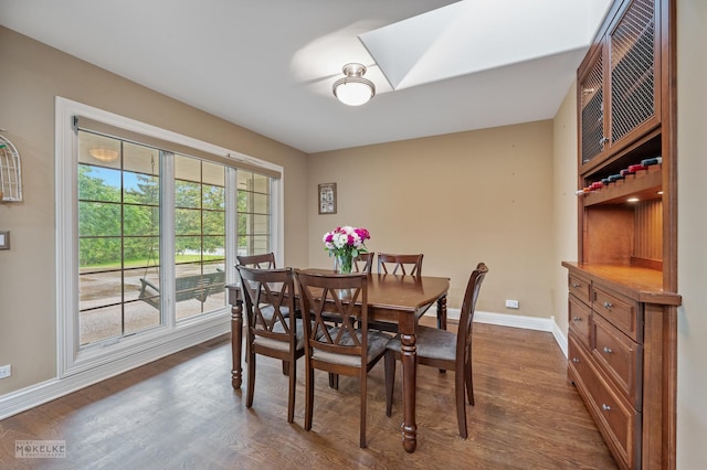 7S745 State Route 53rd Hwy, Naperville, IL 60540 - dining room featuring baseboards, dark wood finished floors, and a skylight
