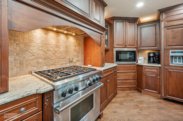 7S745 State Route 53rd Hwy, Naperville, IL 60540 - kitchen featuring stainless steel stove, backsplash, built in microwave, premium range hood, and light wood-type flooring