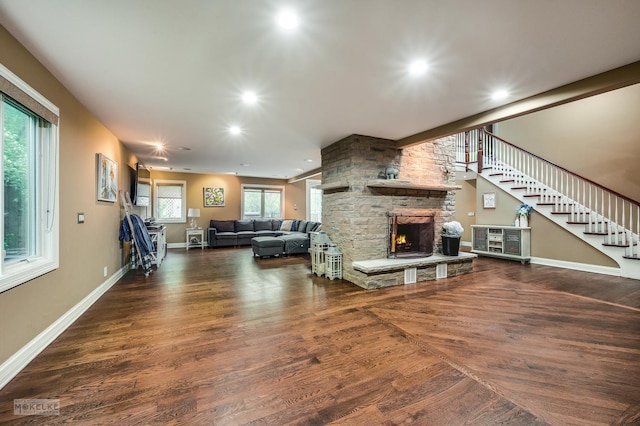 7S745 State Route 53rd Hwy, Naperville, IL 60540 - living room with a stone fireplace, wood finished floors, stairs, recessed lighting, and baseboards