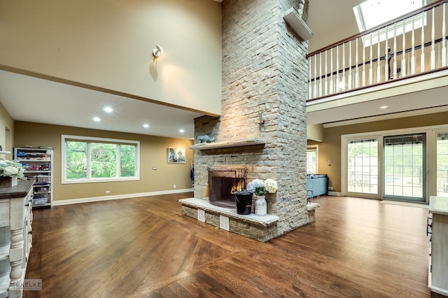 7S745 State Route 53rd Hwy, Naperville, IL 60540 - living room with a towering ceiling, a stone fireplace, baseboards, wood finished floors, and recessed lighting