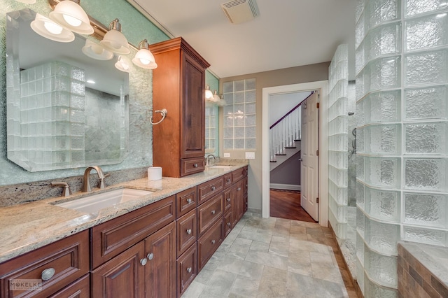 7S745 State Route 53rd Hwy, Naperville, IL 60540 - full bathroom with stone finish flooring, double vanity, a tile shower, and baseboards