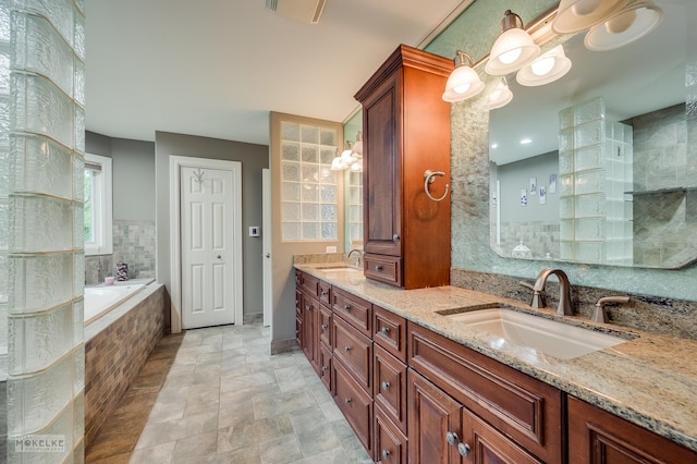 7S745 State Route 53rd Hwy, Naperville, IL 60540 - full bathroom with double vanity, a bath, stone finish floors, and baseboards