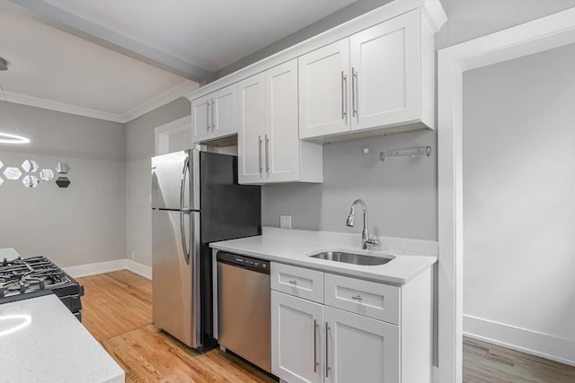 5415 S Dorchester Ave Unit 2B, Chicago, IL 60615 - kitchen with stainless steel appliances, a sink, light countertops, white cabinetry, and ornamental molding