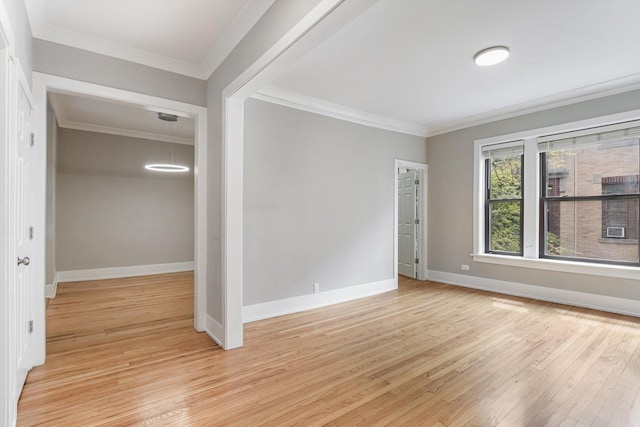 5415 S Dorchester Ave Unit 2B, Chicago, IL 60615 - spare room with crown molding, light wood-style flooring, and baseboards