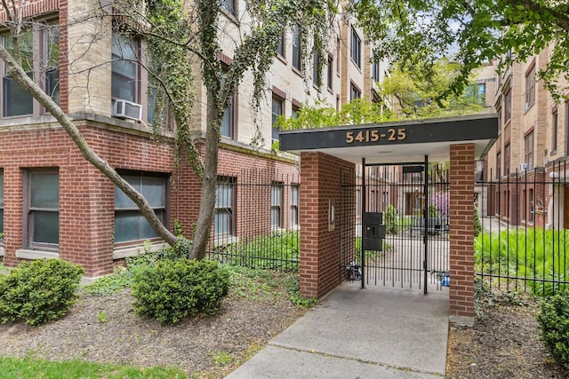 5415 S Dorchester Ave Unit 2B, Chicago, IL 60615 - view of building exterior with fence and cooling unit