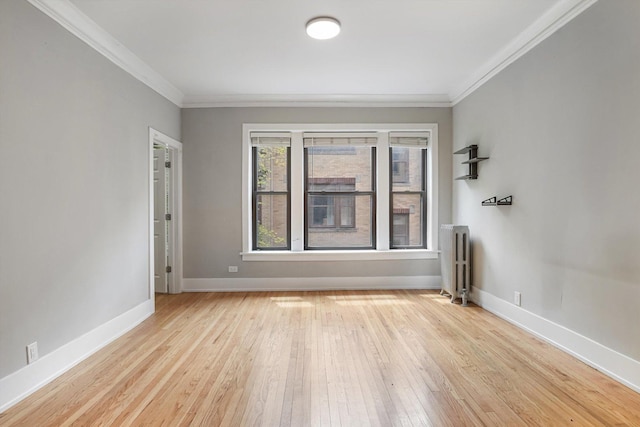 5415 S Dorchester Ave Unit 2B, Chicago, IL 60615 - empty room with radiator, crown molding, hardwood / wood-style flooring, and baseboards