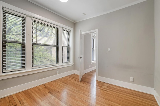 5415 S Dorchester Ave Unit 2B, Chicago, IL 60615 - spare room with baseboards, healthy amount of natural light, light wood-style flooring, and crown molding