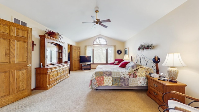 bedroom featuring light colored carpet, a ceiling fan, vaulted ceiling, and visible vents