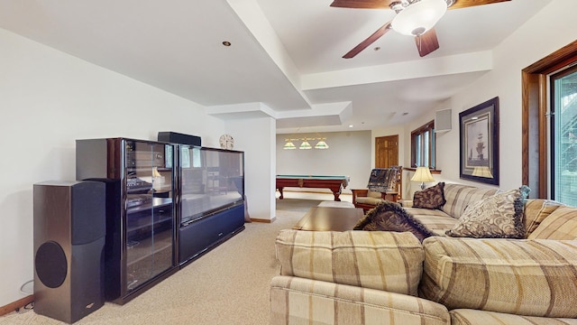 living room with billiards, baseboards, a ceiling fan, and light colored carpet