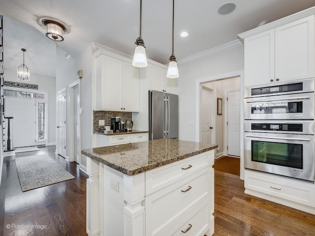 1033 Hickory Dr, Western Springs, IL 60558 - kitchen featuring stainless steel gas stovetop, backsplash, a peninsula, and a chandelier