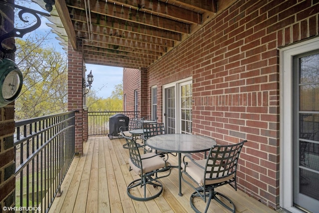 2365 Waukegan Rd Unit 2C, Northbrook, IL 60062 - deck featuring a grill and outdoor dining area