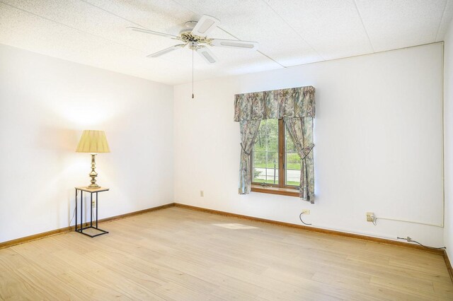2608 186th St Unit 105, Lansing, IL 60438 - spare room featuring ceiling fan, baseboards, and light wood-type flooring