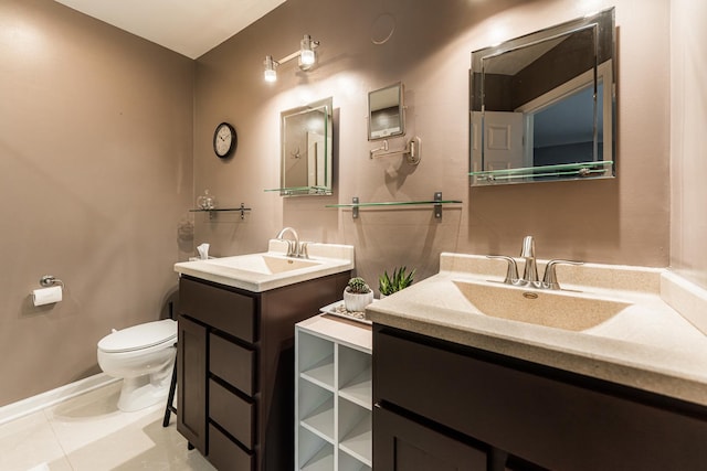 1106 Andover Ct, Glendale Heights, IL 60139 - bathroom featuring toilet, two vanities, baseboards, and tile patterned flooring