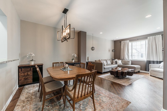1106 Andover Ct, Glendale Heights, IL 60139 - dining area with wood finished floors, a chandelier, and baseboards