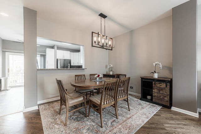 1106 Andover Ct, Glendale Heights, IL 60139 - dining room featuring dark wood-style flooring, a chandelier, and baseboards