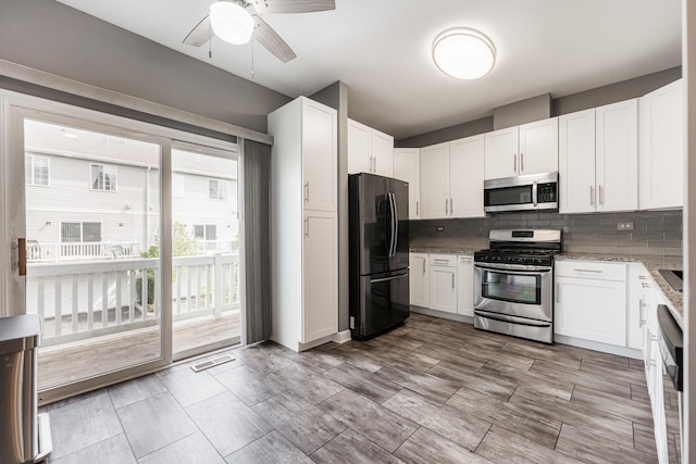 1106 Andover Ct, Glendale Heights, IL 60139 - kitchen with stainless steel appliances, ceiling fan, tasteful backsplash, and white cabinets