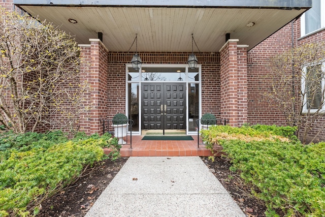 entrance to property with brick siding