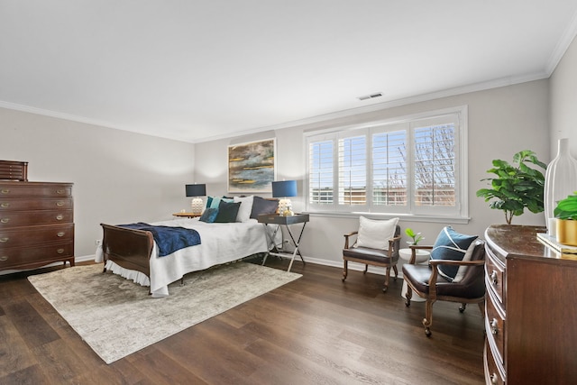 bedroom with baseboards, visible vents, dark wood-type flooring, and crown molding
