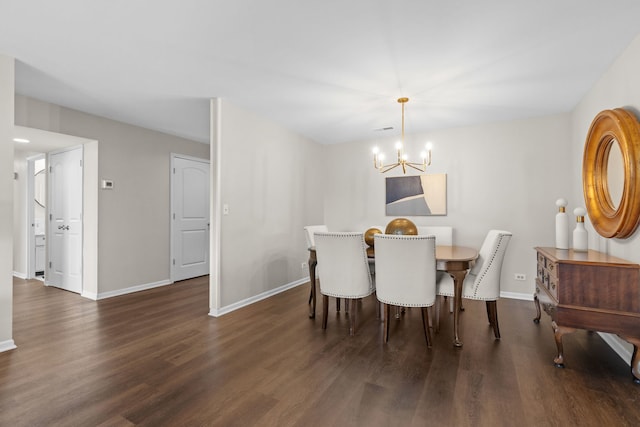 dining space with a chandelier, baseboards, and dark wood-style floors