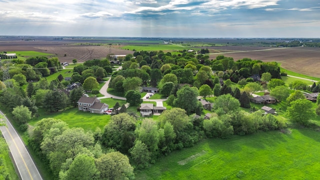 aerial view of sparsely populated area featuring a tree filled landscape