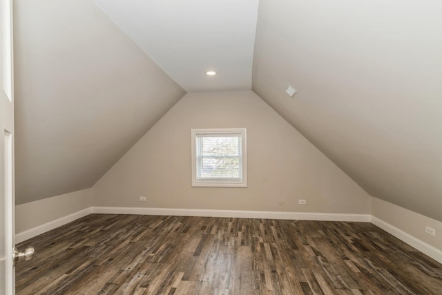 bonus room with dark wood-style floors, baseboards, lofted ceiling, and recessed lighting
