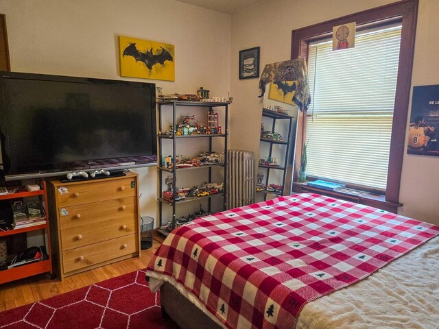bedroom with wood finished floors