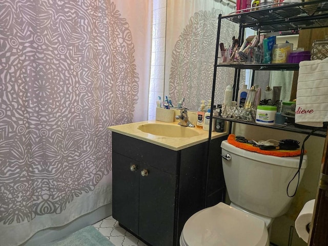 bathroom with toilet and vanity