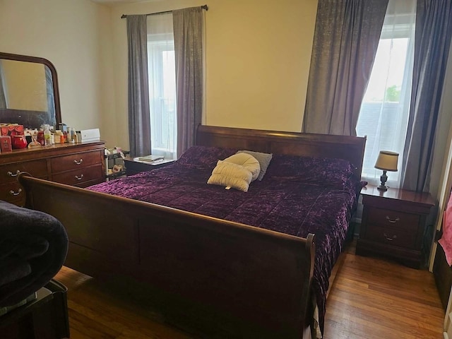 bedroom featuring wood finished floors