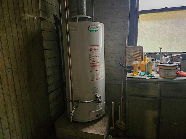 utility room featuring gas water heater
