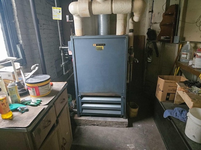 utility room with heating unit