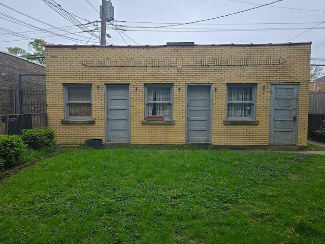 view of outbuilding featuring fence