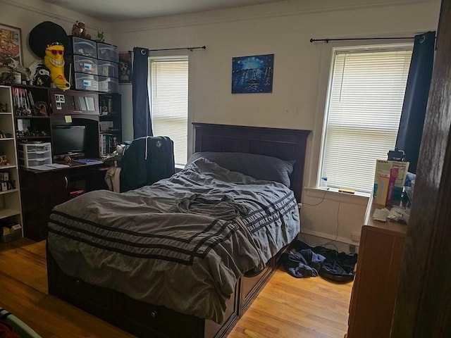 bedroom with wood finished floors