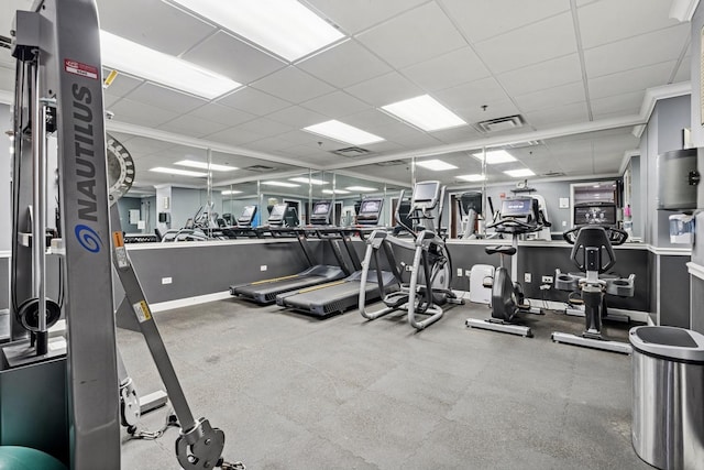 gym featuring a paneled ceiling