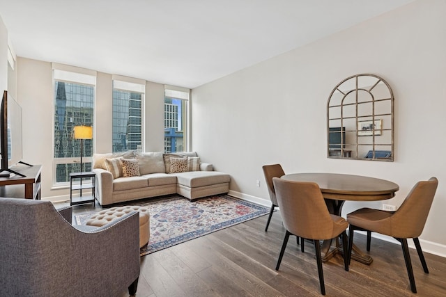 living room with wood finished floors and baseboards