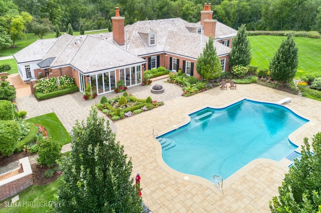 546 Oak Knoll Rd, Barrington Hills, IL 60010 - outdoor pool featuring a diving board, a patio, a yard, and a fire pit
