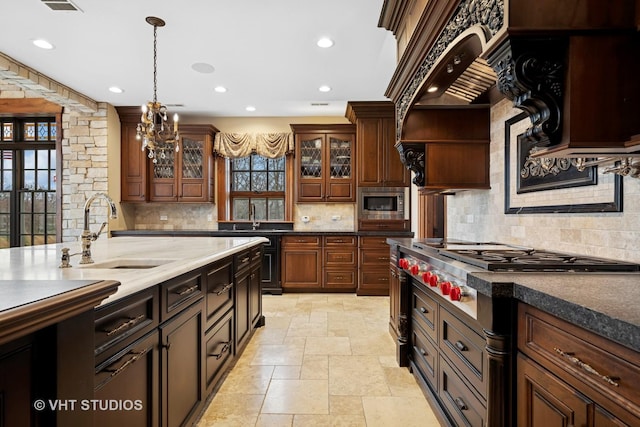 546 Oak Knoll Rd, Barrington Hills, IL 60010 - kitchen with tasteful backsplash, pendant lighting, stone tile flooring, and a sink