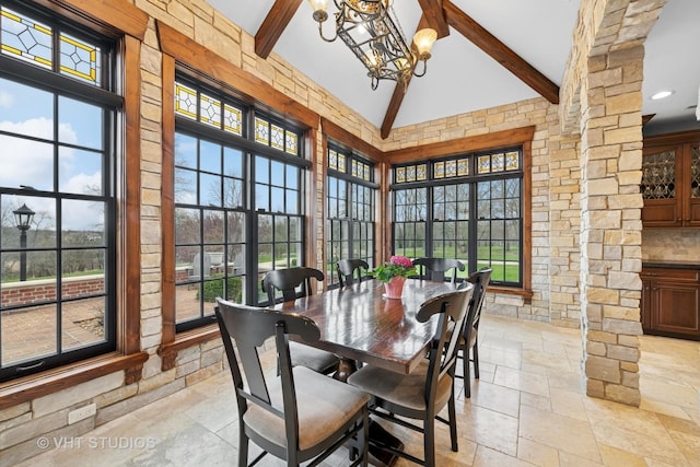 546 Oak Knoll Rd, Barrington Hills, IL 60010 - dining area featuring stone tile flooring, high vaulted ceiling, beamed ceiling, and a notable chandelier