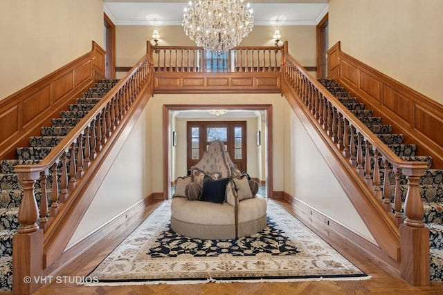 546 Oak Knoll Rd, Barrington Hills, IL 60010 - entryway featuring crown molding, light wood finished floors, stairs, and a chandelier