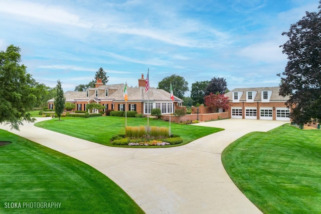 546 Oak Knoll Rd, Barrington Hills, IL 60010 - surrounding community with a lawn, driveway, and a garage