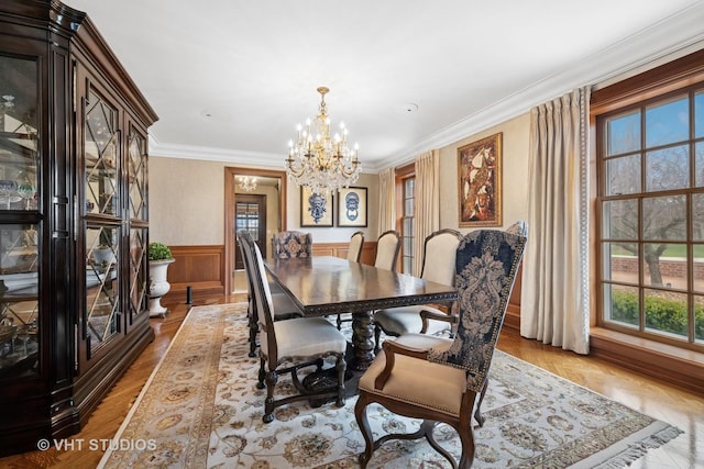 546 Oak Knoll Rd, Barrington Hills, IL 60010 - dining room with ornamental molding, a wainscoted wall, an inviting chandelier, and a healthy amount of sunlight