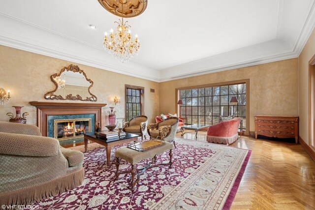 546 Oak Knoll Rd, Barrington Hills, IL 60010 - living area featuring a notable chandelier, a raised ceiling, crown molding, baseboards, and a high end fireplace