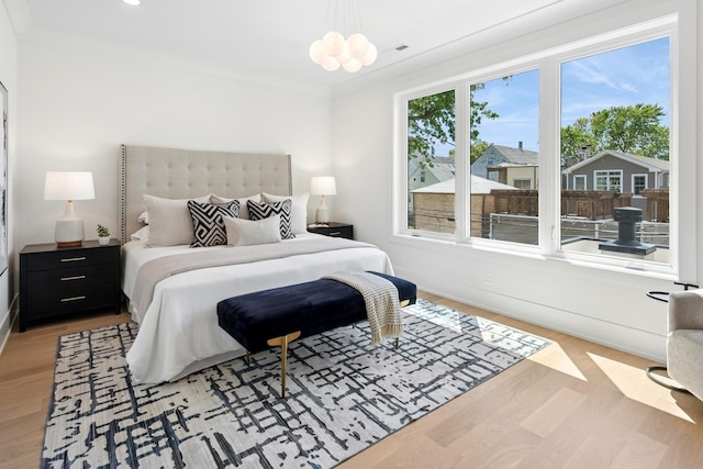 3452 N Bell Ave, Chicago, IL 60618 - bedroom featuring a chandelier, light wood-style floors, and recessed lighting
