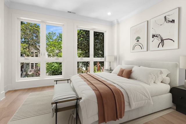 3452 N Bell Ave, Chicago, IL 60618 - bedroom featuring multiple windows, light wood-type flooring, and recessed lighting
